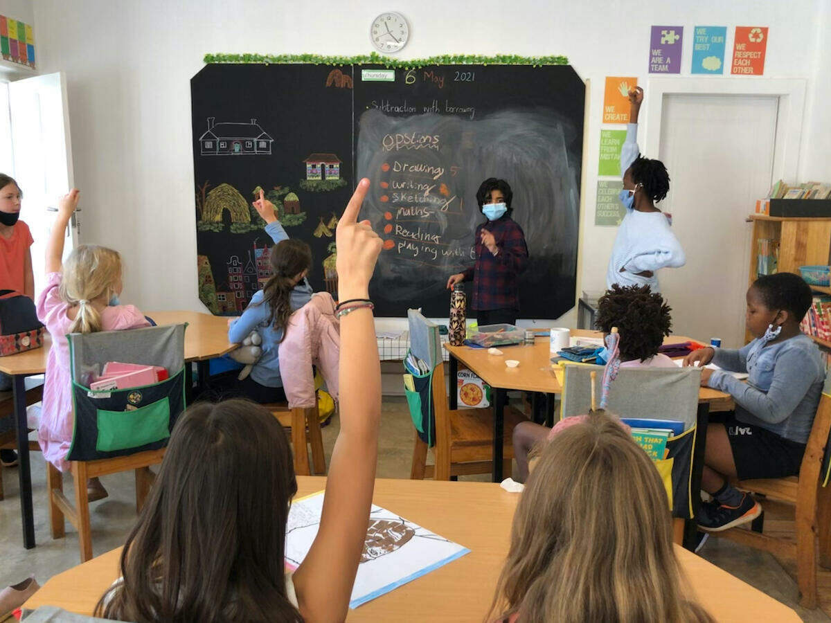 children in class without uniforms