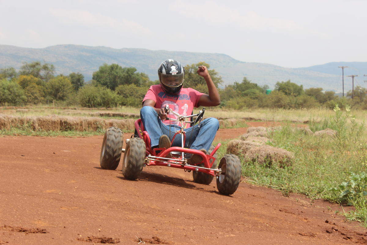 Brown man go-karting